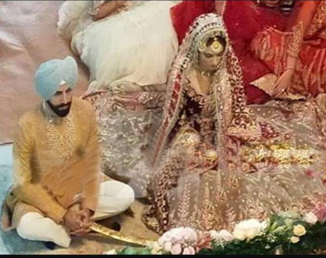 Gurrick Mann and Simran Kaur Mundi exchanging vows at the wedding function.