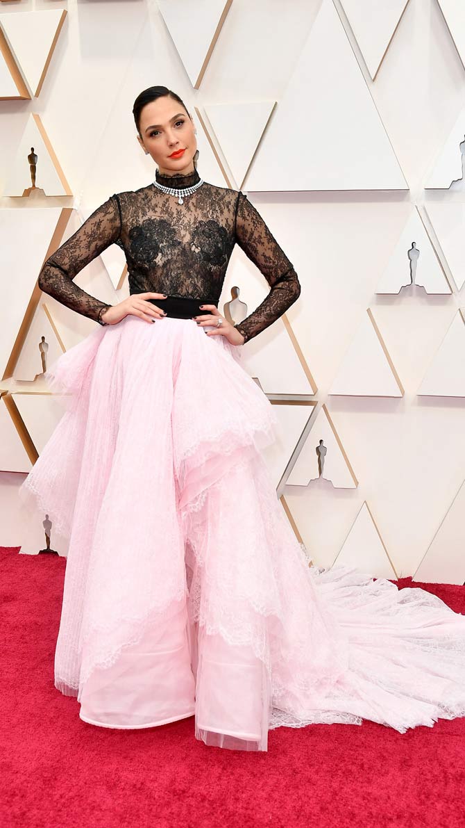 Speaking about fashion, Wonder Woman Gal Gadot became the trendsetter on the red carpet by opting for a lacy-ruffled dress. Her layered lace skirt, paired with a black turtleneck lace top was completed with pretty red lipstick and gelled hair.