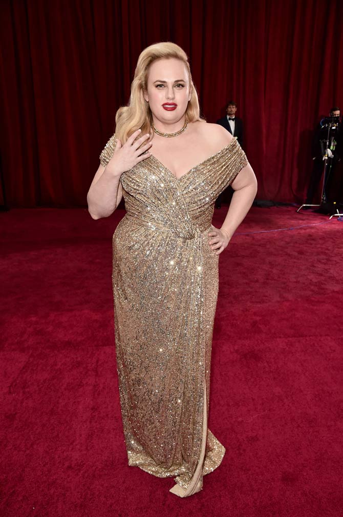 Rebel Wilson, the Isn't It Romantic actress walked the red carpet in a golden sequin off-shoulder gown.