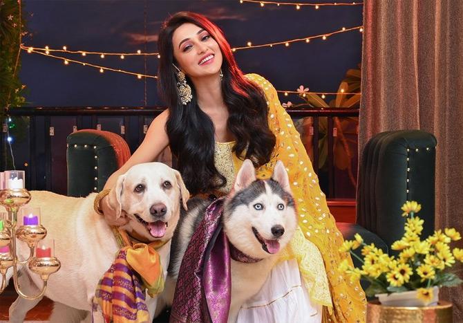 In photo: Mimi Chakraborty looks breathtaking in an ethnic outfit as she celebrates the festival of light with her pet dogs Chickoo and Max.