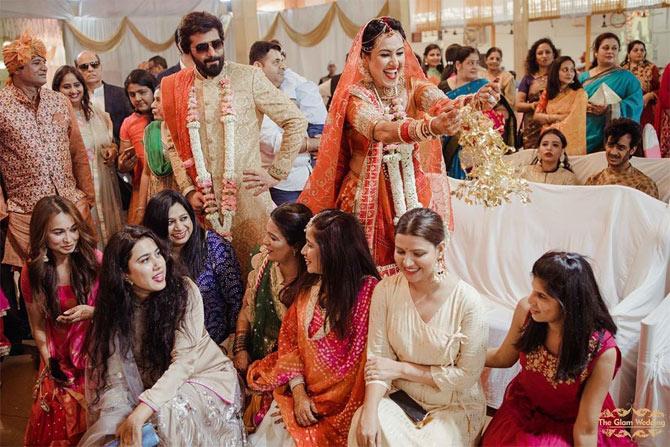 Kaleerein time! A Punjabi bride's wedding look is incomplete without the gorgeous Kaleera. In picture: Kamya is seen flaunting her Kaleerein, which are tied to her chooda, and her bridesmaids are sitting on the floor. According to Punjabi wedding rituals, The bride-to-be is supposed to shake the kaleeras on every bridesmaids' head.