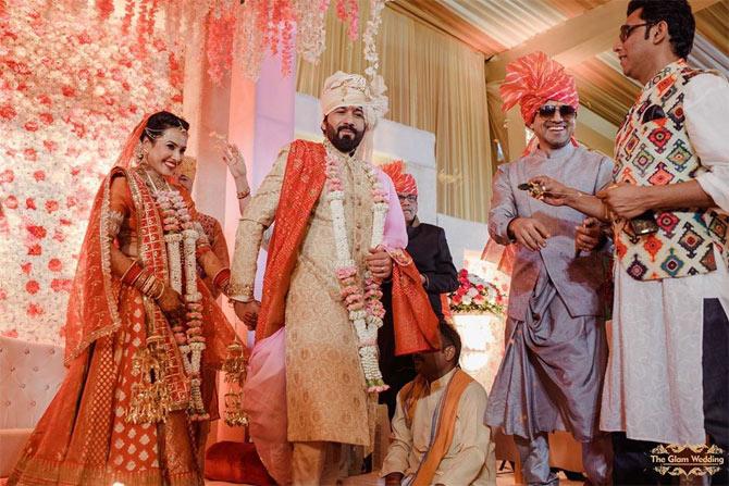 Here the couple can be seen taking the 7 pheras, a wedding ritual practiced by the Hindus.