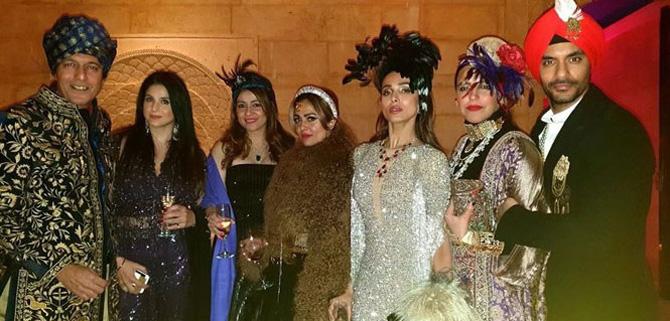 Bollywood's royalty, too, posed for a photo together. Neha Dhupia was resplendent in her golden-violet Indo-western costume, while Malaika Arora was stunning in a shimmery gold number.