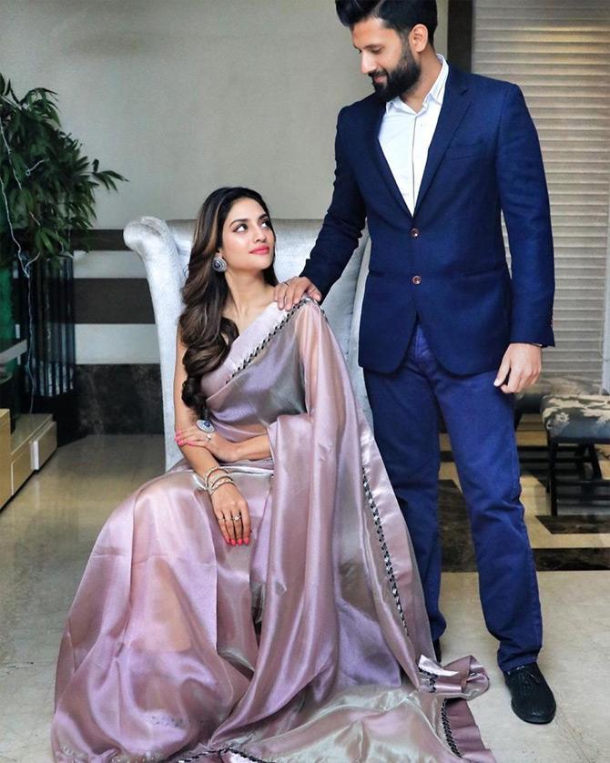 Nusrat also shared a stunning picture where she can't seem to get her eyes off her husband Nikhil Jain. From Nusrat's candid eye contact with Nikhil and her lovey-dovey captions, its evident that Nusrat got poetic for Nikhil Jain.


