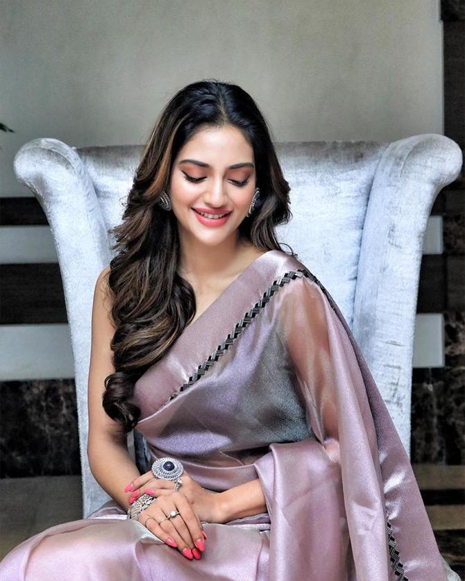 In photo: Nusrat Jahan is all smiles for the cameras as she looks stunning in a lilac saree




