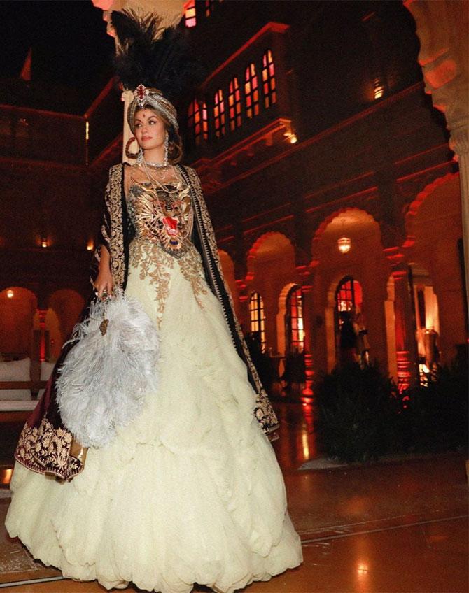 Natasha Poonawalla, who was recently announced as the Chair of the British Asian Trust's Children's Protection Fund for India by His Royal Highness Prince Charles of Wales, looked regal in a layered ivory gown, a black jacket and a feathered headdress complete with a white fan in one hand.