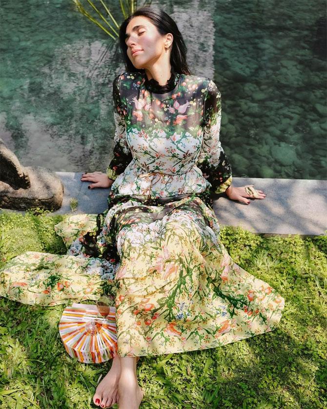 She effortlessly blends in with nature in this printed dress.