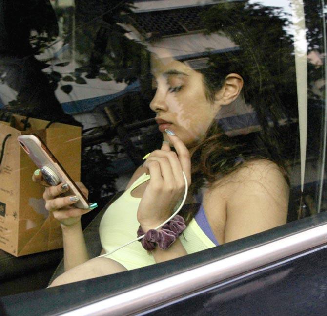 Janhvi Kapoor was caught up on her phone when clicked by the paparazzi in the city.