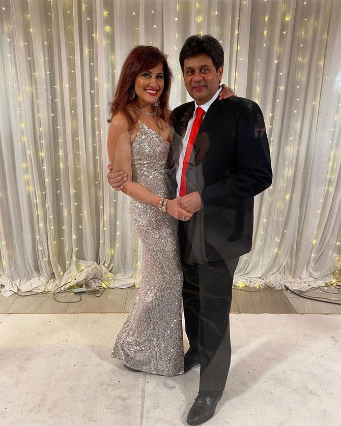 In picture: Yasmin Karachiwala in a glittery long silver gown as she gets clicked with Minhaz Karachiwala hand-in-hand.