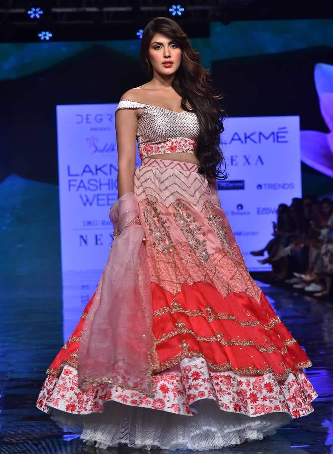 Rhea Chakraborty was the showstopper for designer Deepa Goel at Lakme Fashion Week Summer/Resort 2020, Day 5. Deepa's Instagram count mentioned the details of the show, which read - The first show of Day 5 at #LFWSR20 was by @6degreeplatform presents Krsna Couture, Pearl & Hariom, Siddh Couture and Rajni Suyach. While @krsnacouture_ brought summer to life with her floral lehengas, 'Ethereal Era' by @siddh.deepagoel was a tribute to Goddess Saraswati with the shades of vermillion and ethnic works, @pearlandhariomjham outlined the concept of an early morning walk into the woods, and the Bargello Palace in Florence known for its colossal interiors was the inspiration behind @raajiyas_official's collection, 'Bargello', embellished by distinctive flat stitches of needlepoint embroidery.