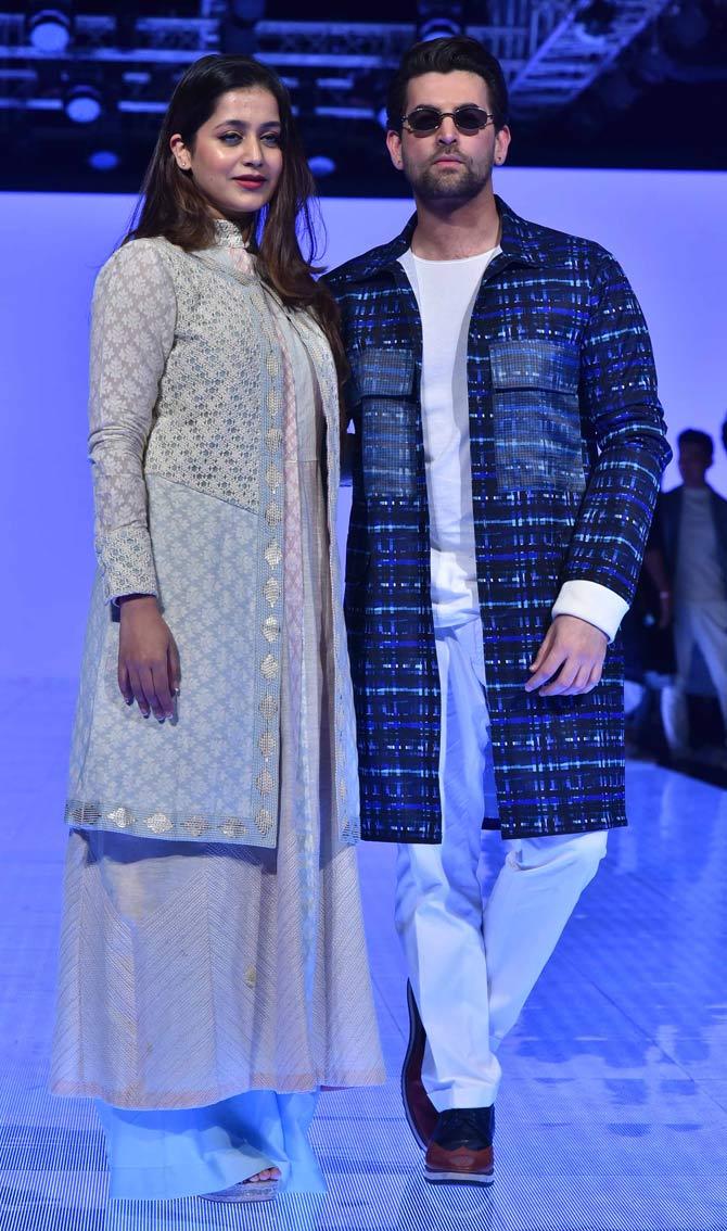 Neil Nitin Mukesh walked the ramp with wife Rukmini to present the collections by Kunal Anil Tanna. The actor also took to his Instagram account and wrote alongside, 