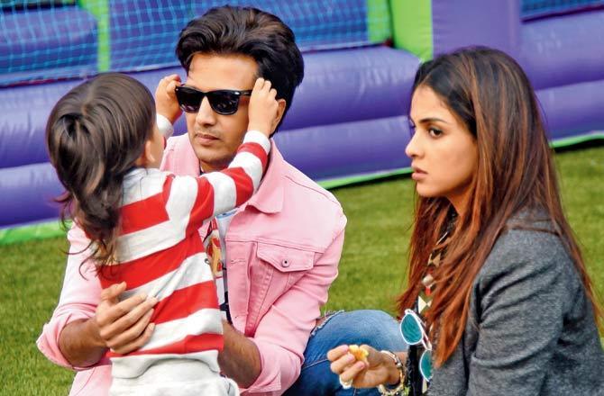 Actor Riteish Deshmukh and wife Genelia D'Souza get a styling lesson from their son in Lokhandwala. Pic/Sameer Markande
