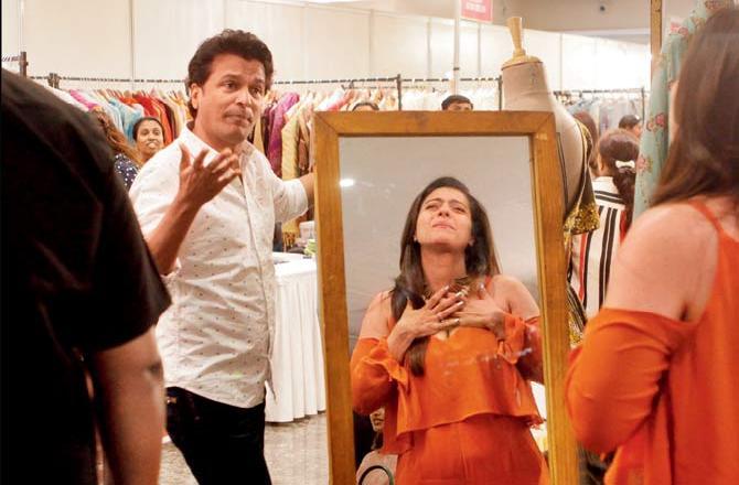 Main meri favourite hoon: Kajol is all self-love as she tries on a Vikram Phadnis creation at a charity exhibition in Worli. Pic/Ashish Raje