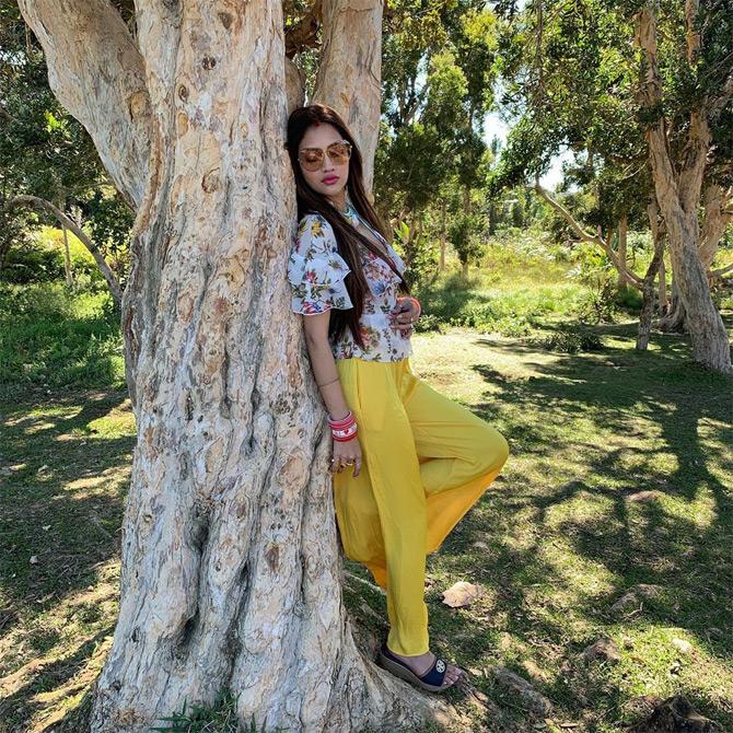 Nusrat Jahan, who shares a unique bond with her husband Nikhil Jain wore a yellow pant paired with a white crop top with black stripes during her honeymoon trip to the picturesque beaches of Mauritius. While sharing this sweet and simple picture, Nusrat wrote: That feel-good vibe...!