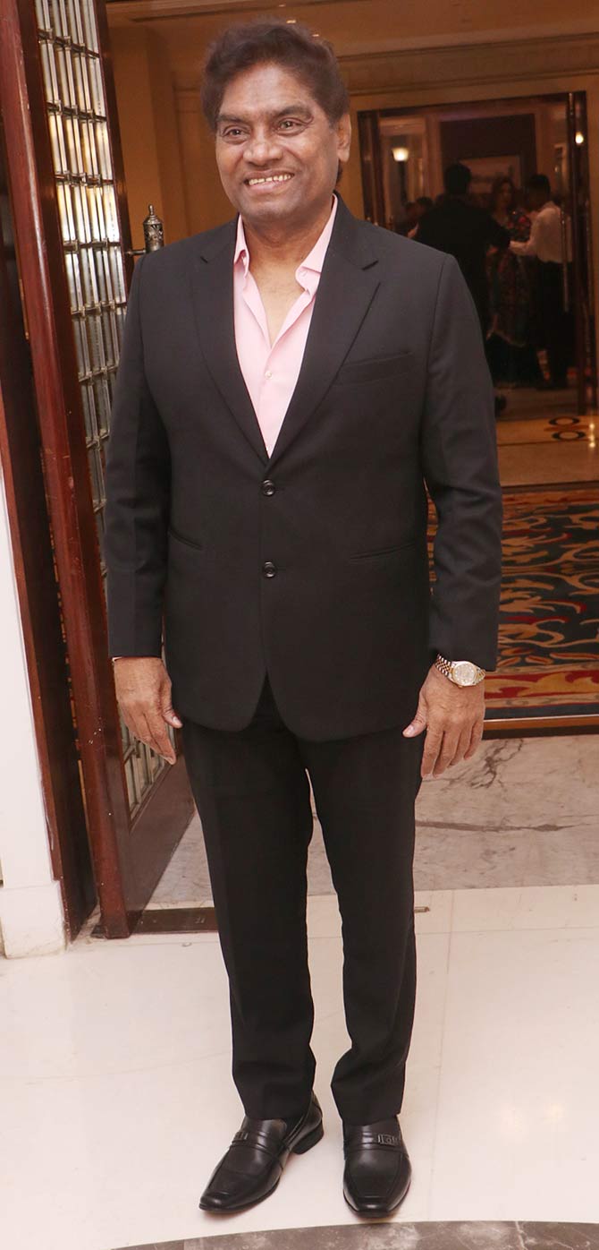Johnny Lever was all smile as he posed for the photographers at the wedding reception.
