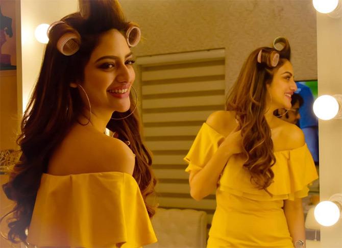 In picture: Nusrat Jahan looks stunning in an off-shoulder dress in hues of yellow as she gets candid for the camera.