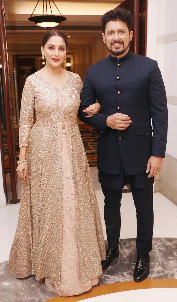 Madhuri Dixit Nene came in with husband Shriram Nene for the wedding reception of Dakshina Nath at the Andheri hotel.