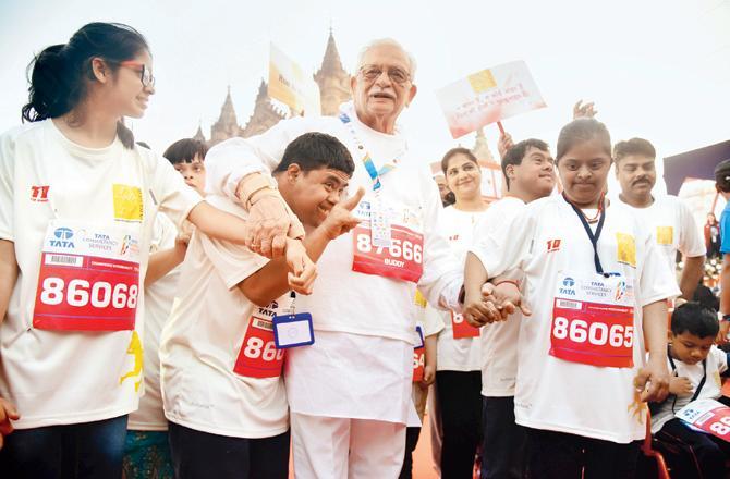Lyricist Gulzar participates in the Mumbai Marathon with members of a non-profit organisation. Hundreds of NGOs join the event every year to raise awareness for their specific work and causes. Pic/ Shadab Khan