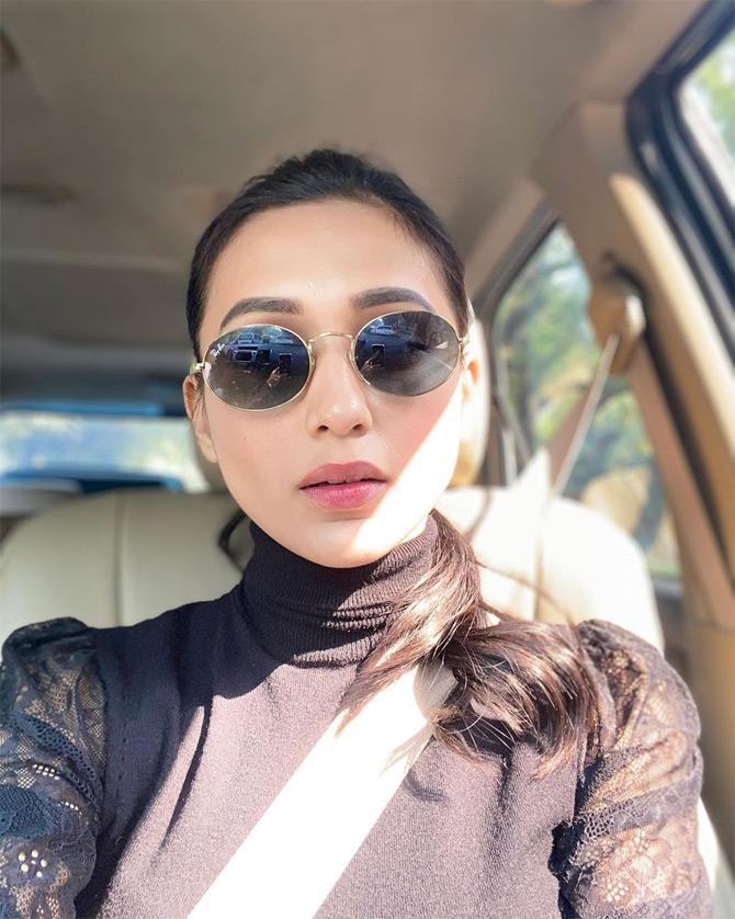 While sharing this heartwarming picture of herself, Mimi Chakraborty was seen enjoying winter in New Delhi. In the photo, Mimi is seen seated in her car as she poses for a selfie. Donning a black top, the 30-year-old politician is seen sporting sunglasses and pink lipstick with subtle makeup. While sharing the photo, Mimi wrote: Hi there winter. She ended her caption with a black sun with rays emoticon