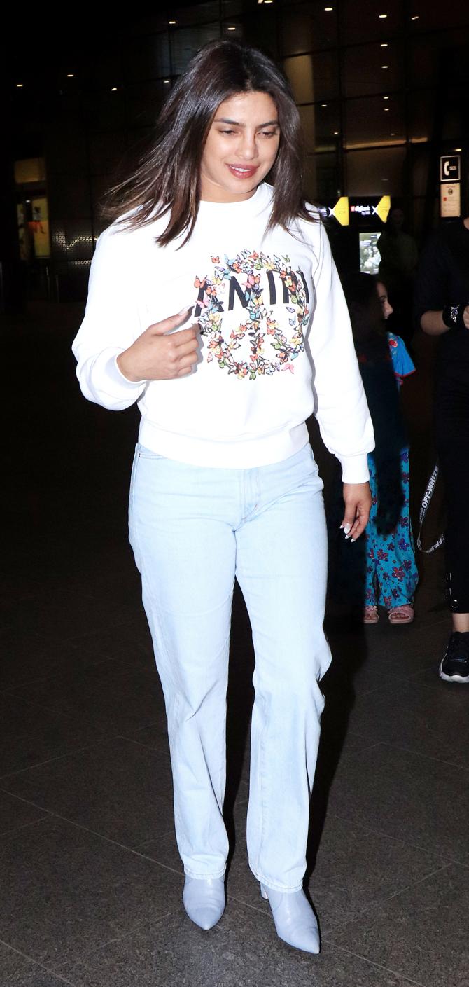 Priyanka Chopra Jonas was spotted in her casual best at the Mumbai airport. The Desi girl was clicked wearing a white sweatshirt, paired with powder blue trouser pants and boots during the outing. All pictures/Datta Kumbhar and Yogen Shah