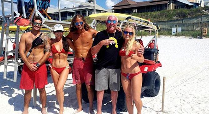 Ric Flair went on to further reveal about his drinking habits saying, 'I'll drink at least 10 beers, and probably five mixed drinks (every day).'
In picture: Ric Flair gets into Baywatch mode with some friends at Rosemary Beach, California