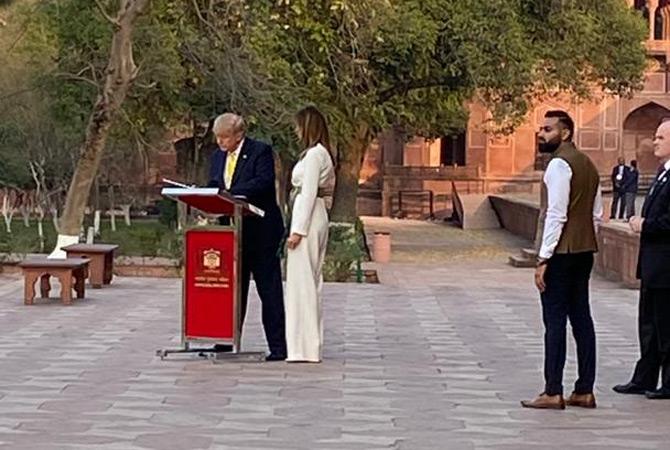 In photo: Donald Trump writes a message in the visitor's book at the Taj Mahal. He wrote: Taj Mahal inspires awe, a timeless testament to the rich and diverse beauty of Indian culture! Thank you, India.