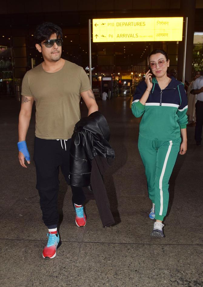 Sonu Nigam was clicked with wife Madhurima Nigam at the Mumbai airport.