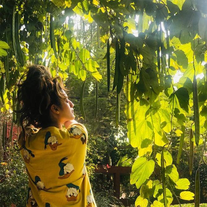 Sharing a leaf out of her shoot scenes, Nusrat donned a yellow printed t-shirt and was seen enjoying the blissful mornings of Kolkata. In the pictures, Nusrat can be seen enjoying her 'Me' time amidst rich flora of Visva-Bharati University, West Bengal.



