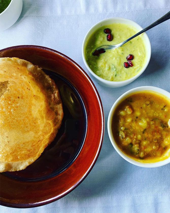 On her trip to Rishikesh near the Ganges, Masaba Gupta indulged in delicious Indian food. Through her post, the 31-year-old designer said that the one way through her heart is good food. While sharing the pictures, Masaba revealed that she loved good, nutritious and wholesome food. The designer binged on aloo puri, makke ki roti and saag and karele ki chaat!








