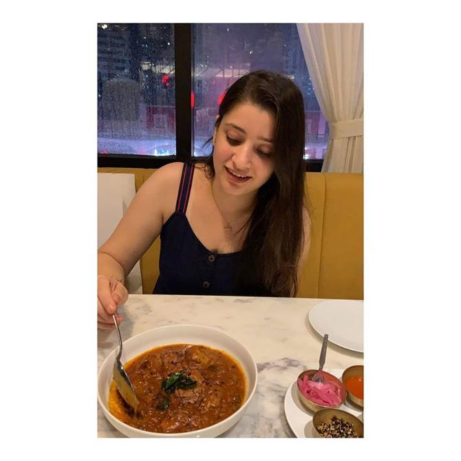 In photo: Natasha Gandhi can't seem to get her eyes off a delicious dish in front of her. While sharing this picture, Natasha in her cheeky way captioned it: Blush at food, not Boys!




