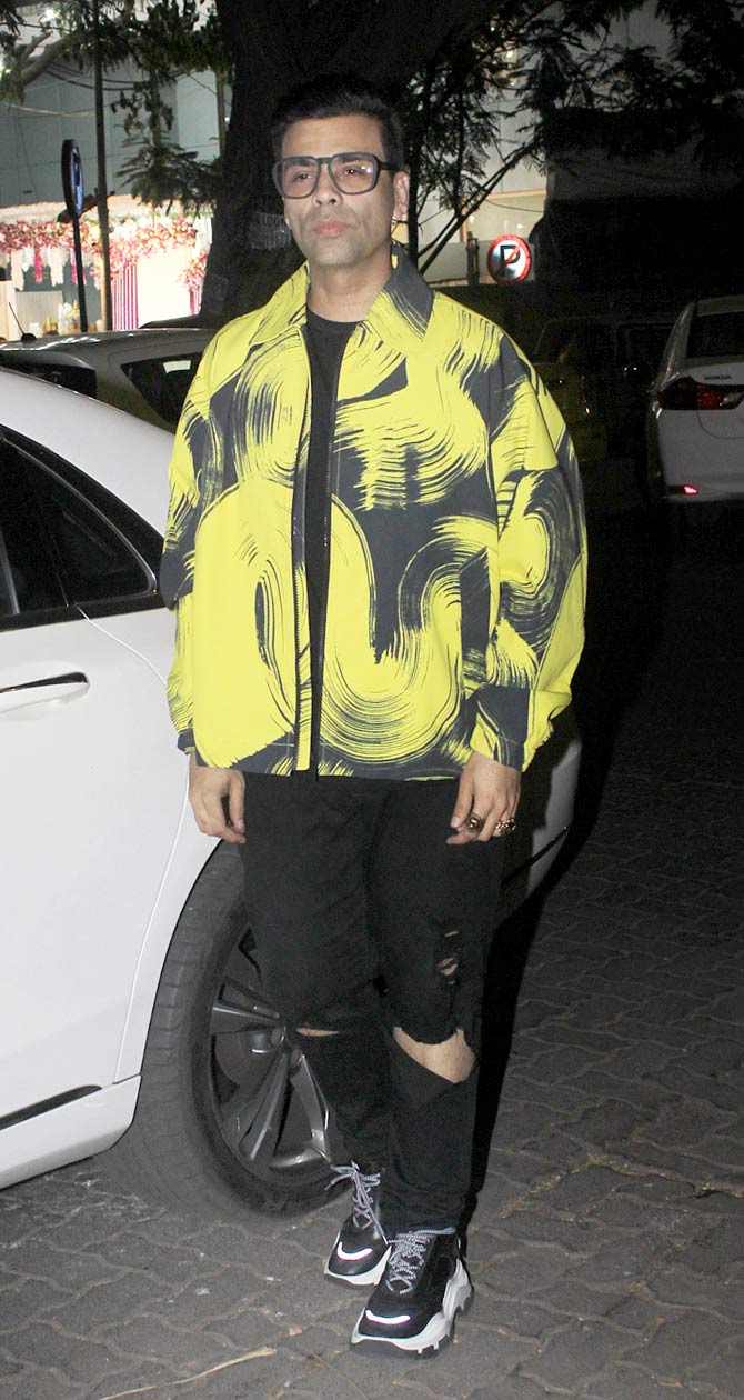 Shashank Khaitan's mentor Karan Johar was snapped wearing a yellow casual jacket, paired with a basic black tee and distress denim as he arrived for the birthday bash.