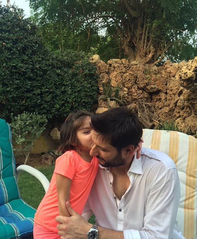 Shahid Afridi made his Test debut for Pakistan on October 22, 1998.
In picture: Shahid Afridi with his daughter