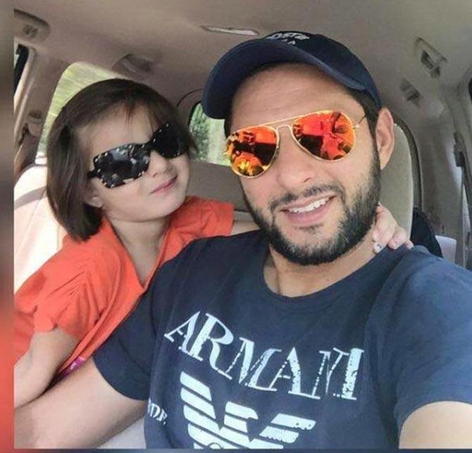 Shahid Afridi has played 99 T02I matches with 1,416 runs and 98 wickets to his name.
In picture: Shahid Afridi with his daughter