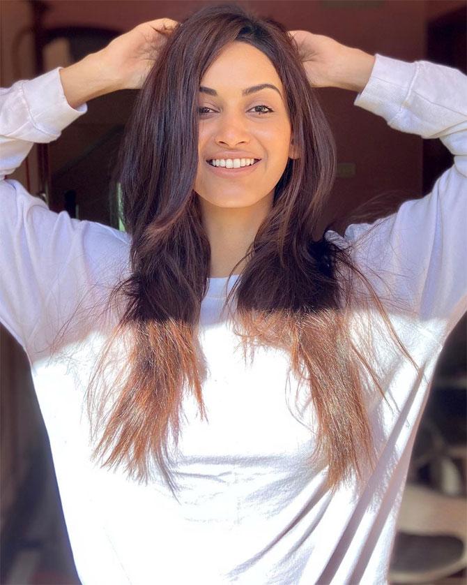 Shivani Jadhav proves that even if it is a plain white t-shirt, she can make it look like couture. She left her hair open and clicked a candid picture with her hands at the back. She wrote, 