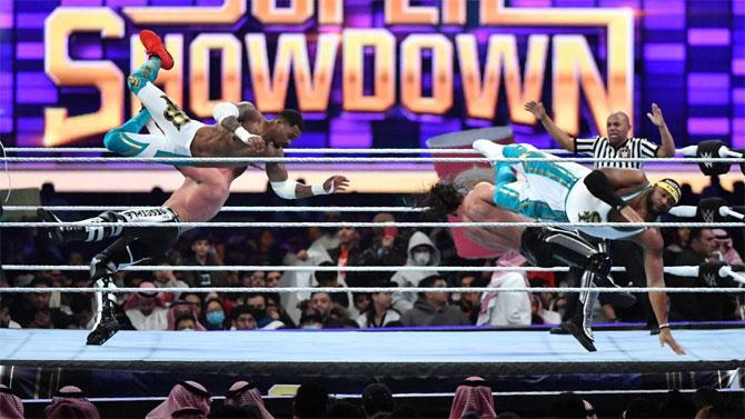 The Street Profits got the audience's attention with their high-flying energizing moves and frog splashes
