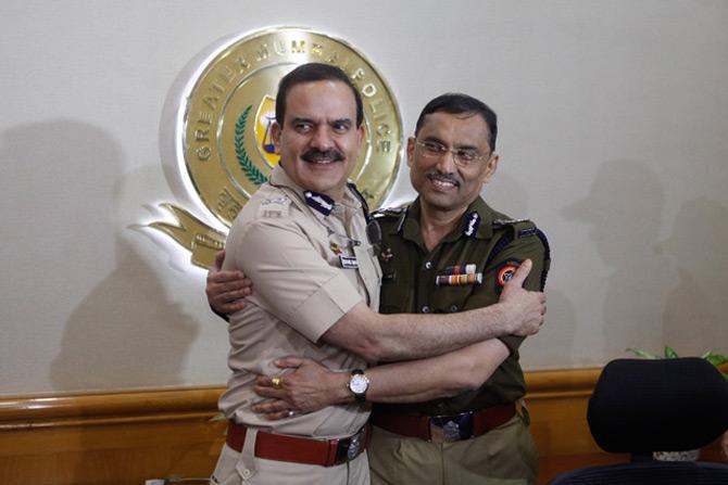 In photo: Former Mumbai Police Commissioner Sanjay Barve shares a warm hug as he welcomes Parambir Singh