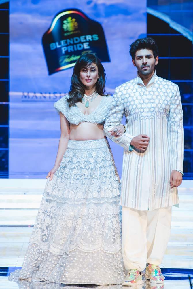 Kareena Kapoor Khan and Kartik Aaryan walked the floor with hand-in-hand wearing dazzling haute couture. Aaryan on Sunday took to Instagram to share a series of pictures from the fashion show for which the two Bollywood actors turned showstoppers. Invoking Kapoor's character of Geet from Jab We Met and his character of Veer from 'Love Aaj Kal', Aaryan captioned one of the pictures, 