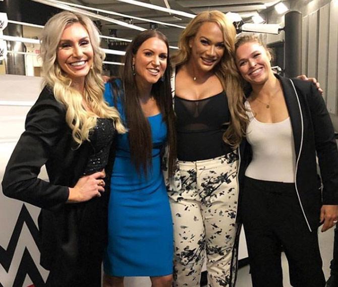 Ronda Rousey was part of the first-ever women's main event to headline WrestleMania. Rousey, Charlotte Flair and Becky Lynch faced each other in a triple threat match at WrestleMania 34.
In picture: Ronda Rousey with Charlotte Flair, Stephanie McMahon and Nia Jax