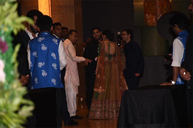 In photo: Akash Ambani and Shloka Mehta share a hearty laugh with uncle Anil Ambani at Armaan Jain's wedding reception 