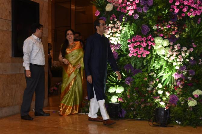 In photo: Rashmi Thackeray caught having a light moment as she follows husband Uddhav Thackeray to pose for the lenses