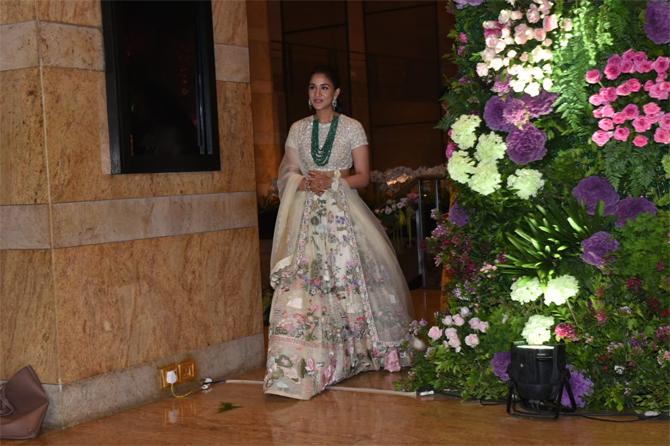 While the entire Ambani family was in attendance for Armaan Jain's wedding reception, it was Mukesh and his youngest son Anant Ambani who gave the grand night a miss. Anant Ambani's family friend Radhika Merchant stole the show with her backless ethnic outfit