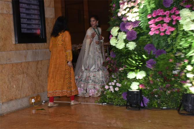 In photo: Radhika Merchant caught in a candid conversation as she arrives for Armaan Jain's wedding reception 