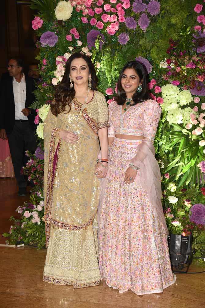 Nita Ambani and daughter Isha Ambani also attended Armaan Jain and Anissa Malhotra's wedding reception. While Nita showed off her fashionable side in a beige coloured lehenga, Isha's floral pink attire was no less than a showstopper outfit.