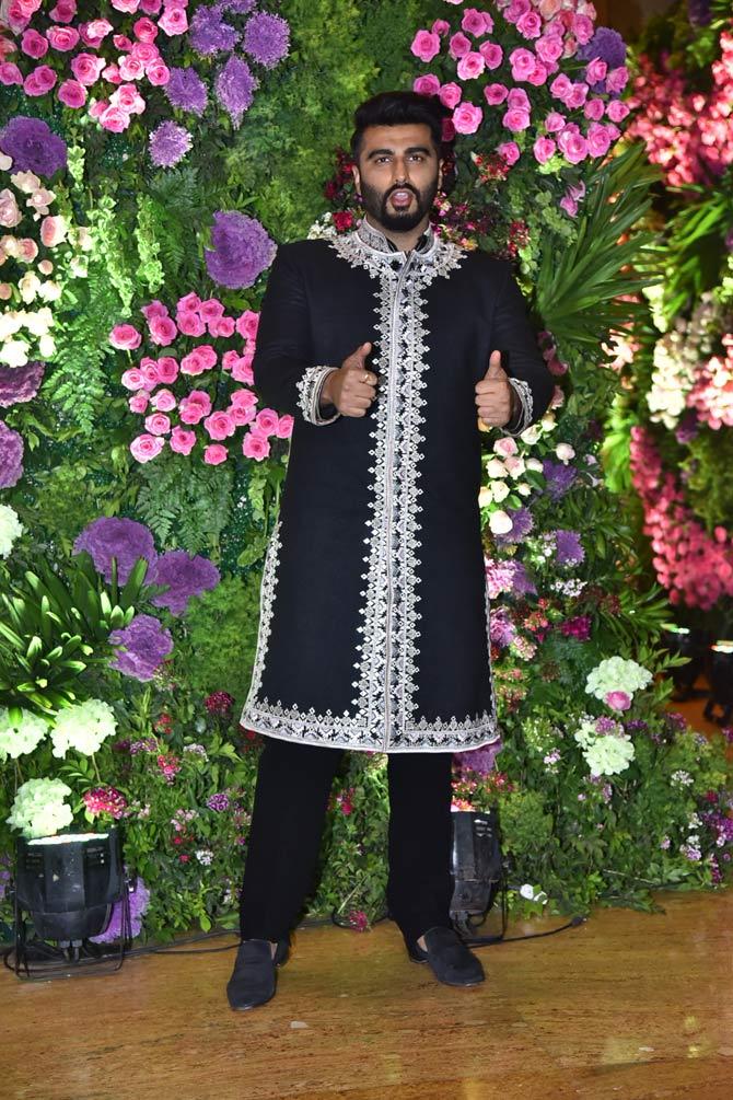 Arjun Kapoor posed for the shutterbugs as he attended Armaan Jain and Anissa Malhotra's reception.