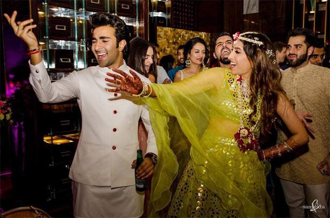 Anissa Malhotra looked gorgeous in a yellow Abu Jani and Sandeep Khosla lehenga she opted for the Sangeet ceremony. Armaan Jain too showed off his uber-cool side in a white kurta-pyjama.
