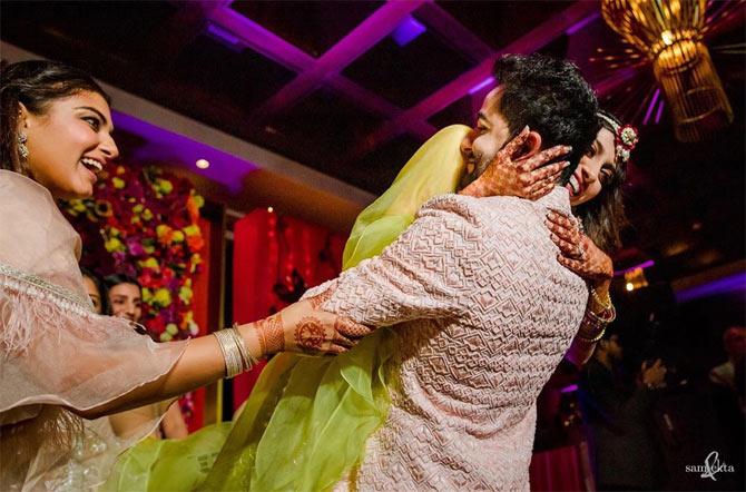 In one of the pictures, Armaan Jain picking his bride was one of the best moments from the big-fat Kapoor wedding.