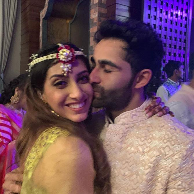 Armaan Jain and Anissa Malhotra tied the knot on February 03, 2020, and the couple's wedding affair no less than a Bollywood film. From Sangeet ceremony, Mehendi, to a grand reception, the entire family has celebrated togetherness in a grand affair! All pictures/Karisma Kapoor, Akanksha Kapoor, Sam & Ekta's Instagram accounts
In picture: Armaan Jain caught planting a kiss on his bride Anissa Malhotra's cheeks at the sangeet ceremony.