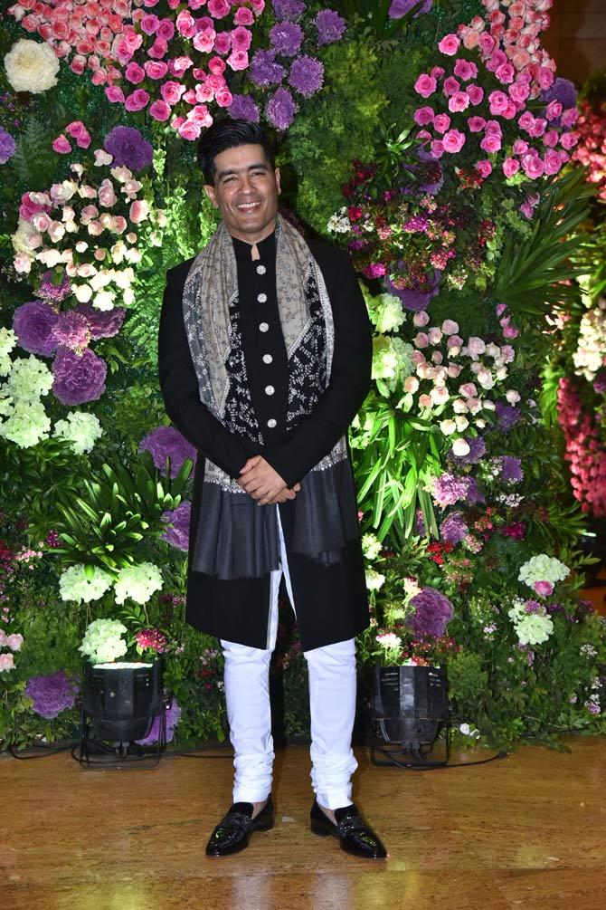Manish Malhotra was all smiles as he attended Armaan Jain and Anissa Malhotra's reception.
