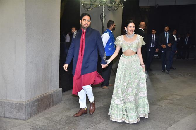 In photo: Akash Ambani and Shloka Mehta are all smiles for the paparazzi as they arrive for Armaan Jain and Anissa Malhotra's grand wedding bash held at The St Regis hotel.