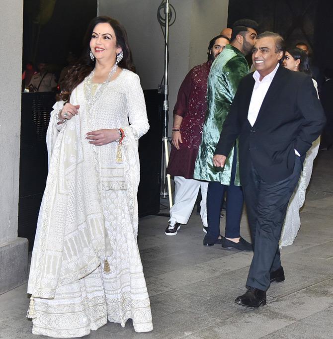 Business magnate Mukesh Ambani walked in with his wife Nita Ambani for the grand wedding bash of Armaan Jain and Anissa Malhotra. The power couple from Mumbai who has been married for over 34 years now added the much-needed glitz and glamour. 